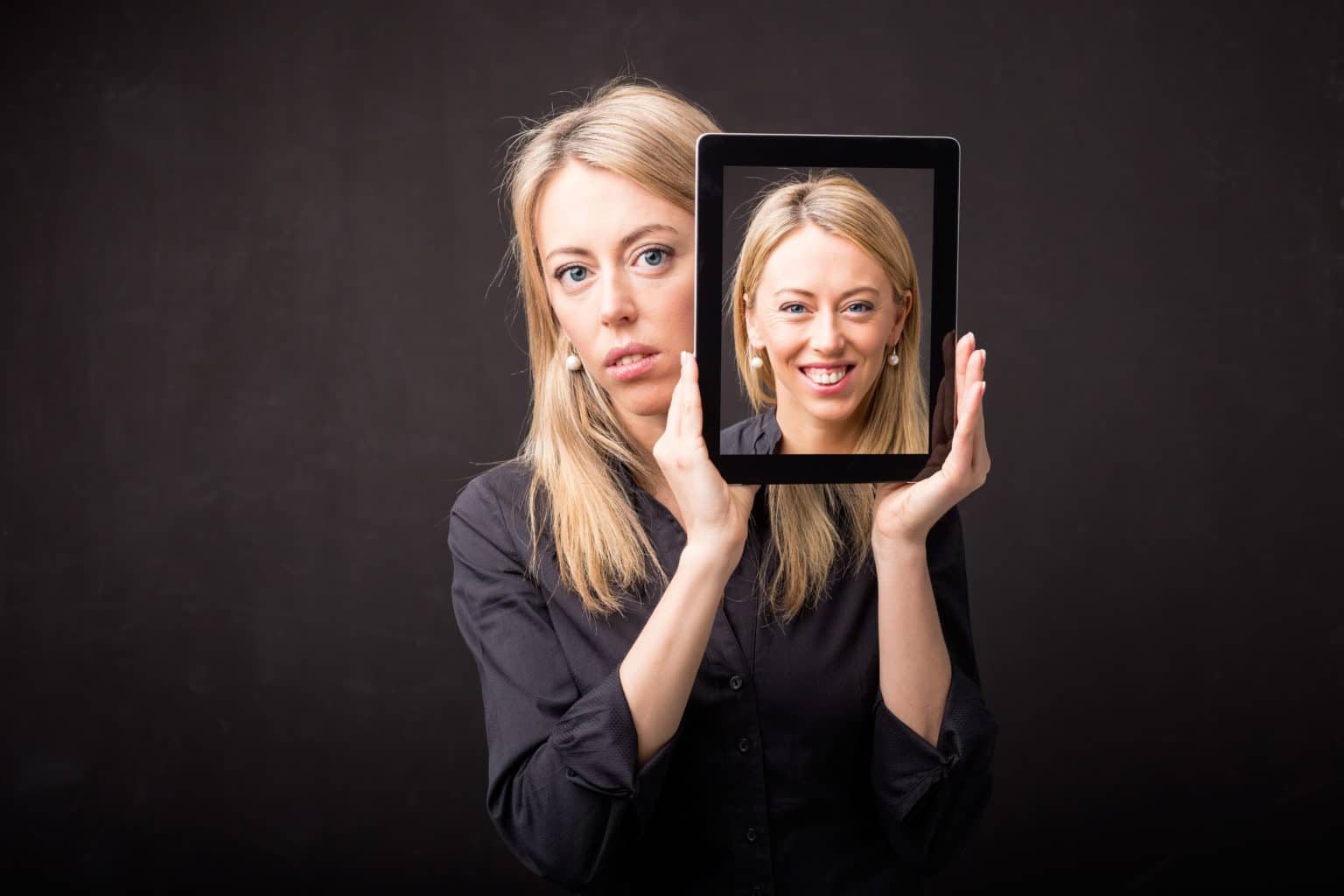 Woman showing happy portrait on tablet